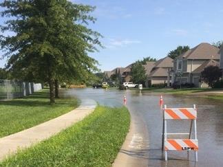 Image of a flooded residential street. Image of a flooded residential street.