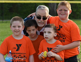 Image of a coach with kids Image of a coach with kids